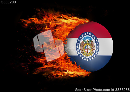 Image of US state flag with a trail of fire - Missouri