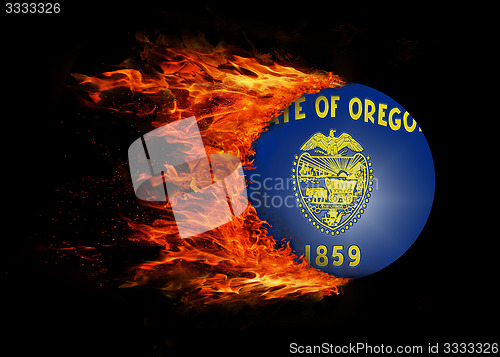 Image of US state flag with a trail of fire - Oregon