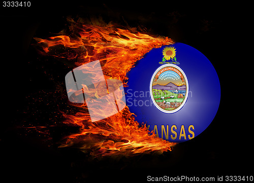 Image of US state flag with a trail of fire - Kansas