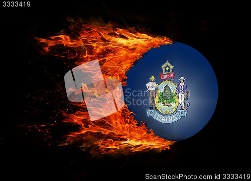 Image of US state flag with a trail of fire - Maine