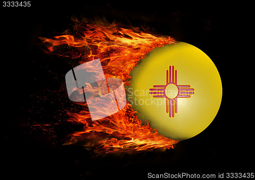 Image of US state flag with a trail of fire - New Mexico