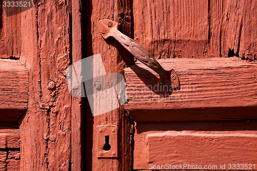 Image of spain knocker lanzarote door wood in the red brown 