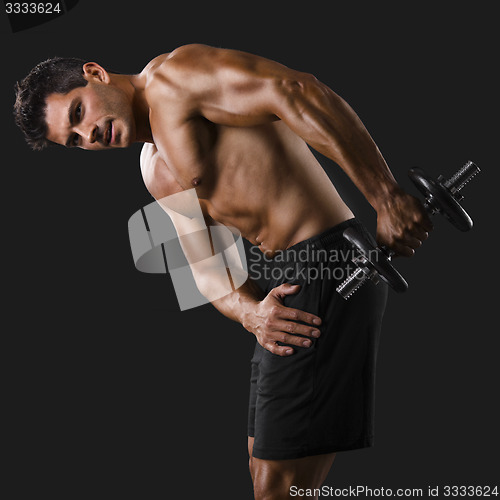 Image of Muscular man lifting weights