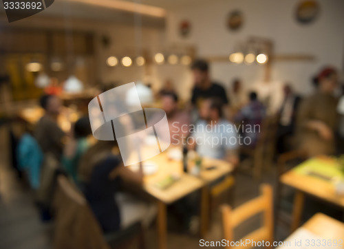 Image of Blurred image of friends at the restaurant