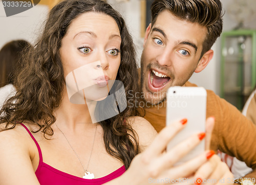 Image of Happy couple making a selfie