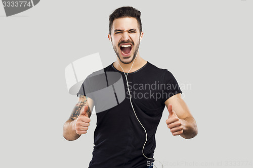 Image of Happy man listen music