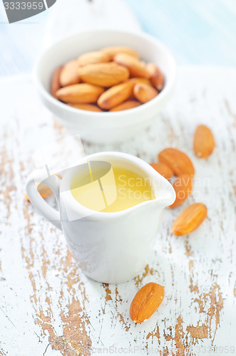 Image of almond essential oil and almond in bowl