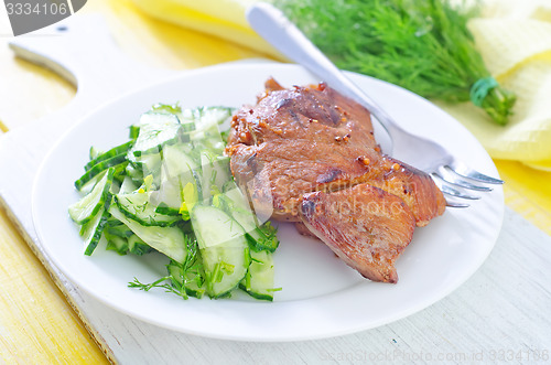 Image of meat with salad