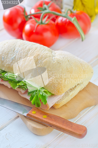 Image of sandwich with ham and cucumber