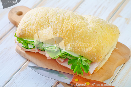 Image of sandwich with ham and cucumber