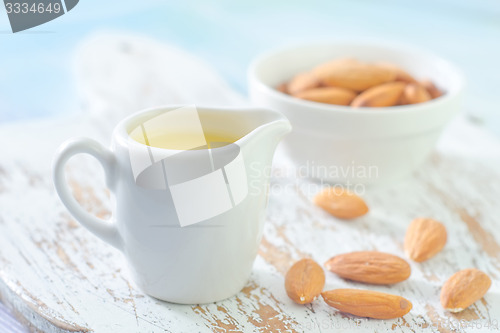 Image of almond essential oil and almond in bowl