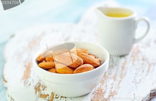 Image of almond essential oil and almond in bowl