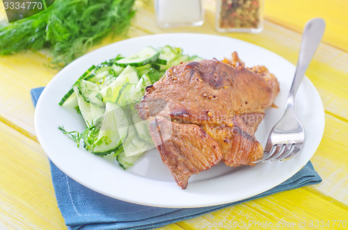 Image of meat with salad