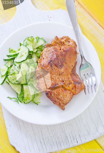 Image of meat with salad