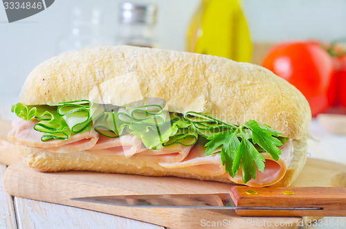 Image of sandwich with ham and cucumber