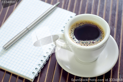 Image of coffee and note