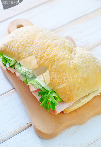 Image of sandwich with ham and cucumber