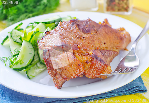 Image of meat with salad