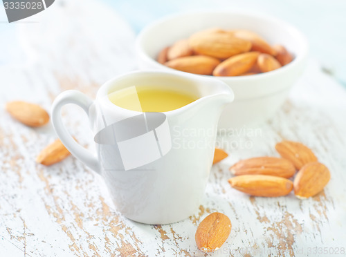 Image of almond essential oil and almond in bowl