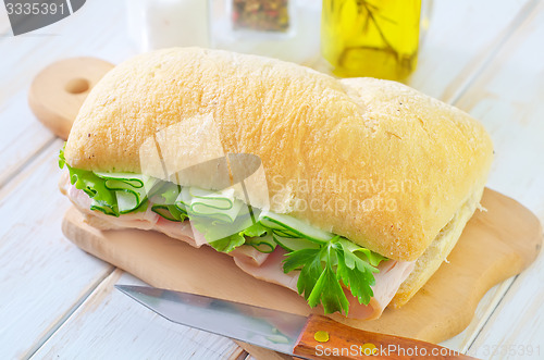 Image of sandwich with ham and cucumber