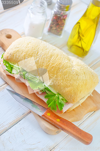 Image of sandwich with ham and cucumber