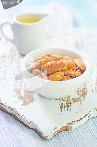 Image of almond essential oil and almond in bowl