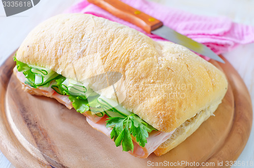 Image of sandwich with ham and cucumber