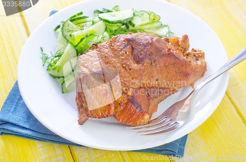 Image of meat with salad