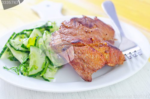 Image of meat with salad