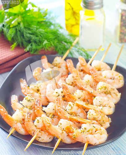 Image of boiled shrimps are beaded on sticks