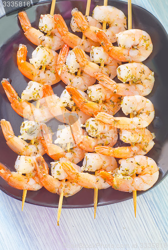 Image of boiled shrimps are beaded on sticks