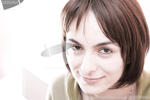 Image of Young woman in bed