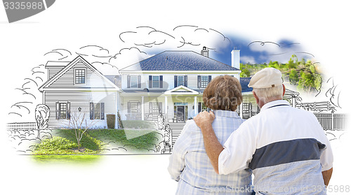 Image of Embracing Senior Couple Over House Drawing and Photo on White