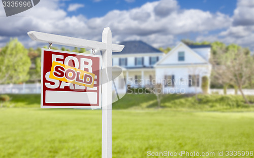 Image of Sold Home For Sale Sign in Front of New House