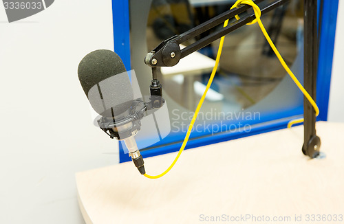 Image of microphone at recording studio or radio station