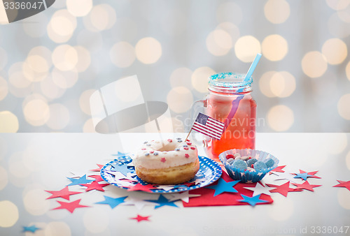 Image of donut with juice and candies on independence day