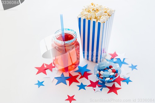 Image of drink and popcorn with candies on independence day