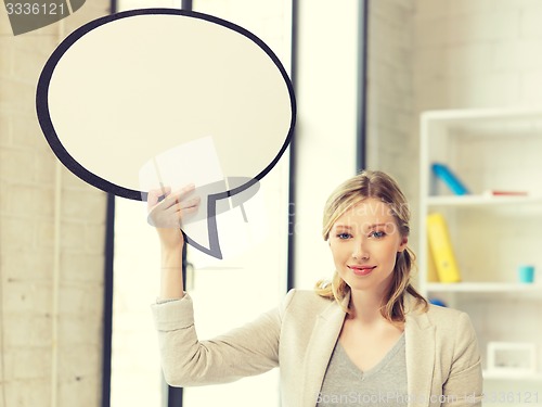 Image of smiling businesswoman with blank text bubble