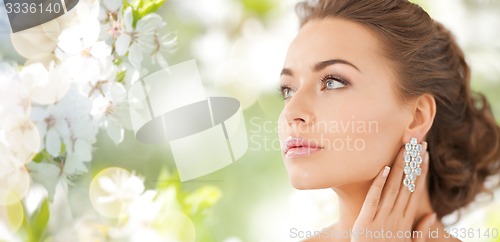 Image of woman with diamond earrings