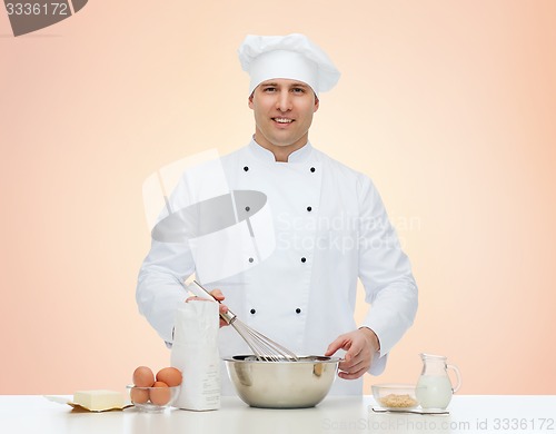 Image of happy male chef cook baking