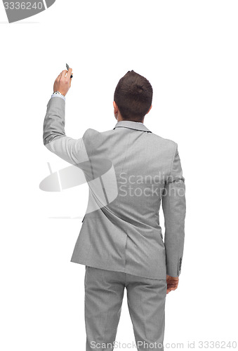 Image of businessman writing or drawing something imaginary