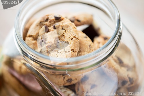 Image of close up of chocolate oatmeal cookies in glass jar