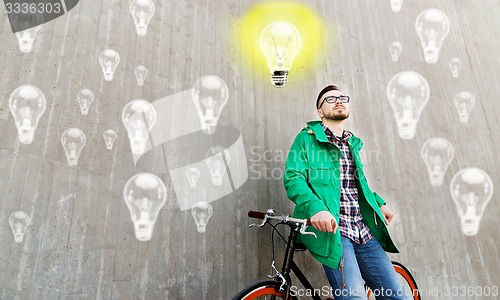 Image of happy young hipster man with fixed gear bike