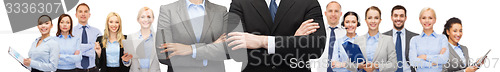 Image of businesswoman and businessman with crossed arms