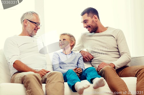 Image of smiling family at home