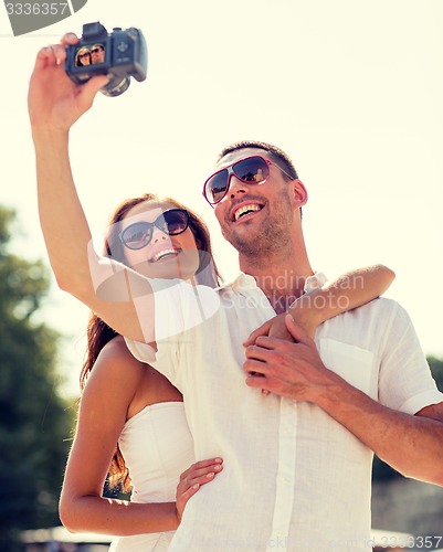 Image of smiling couple in city