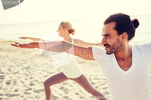 Image of close up of couple making yoga exercises outdoors