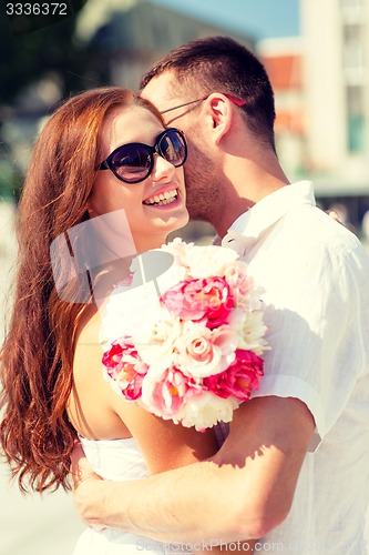 Image of smiling couple in city