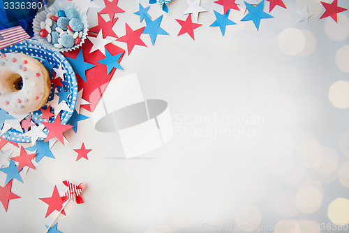 Image of donut with candies and stars on independence day