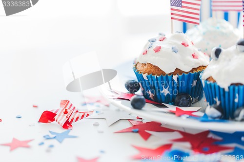 Image of cupcakes with american flags on independence day